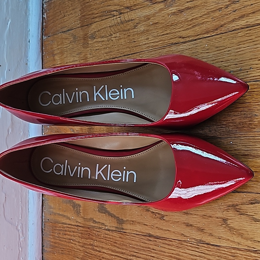 Red pointy toe pumps